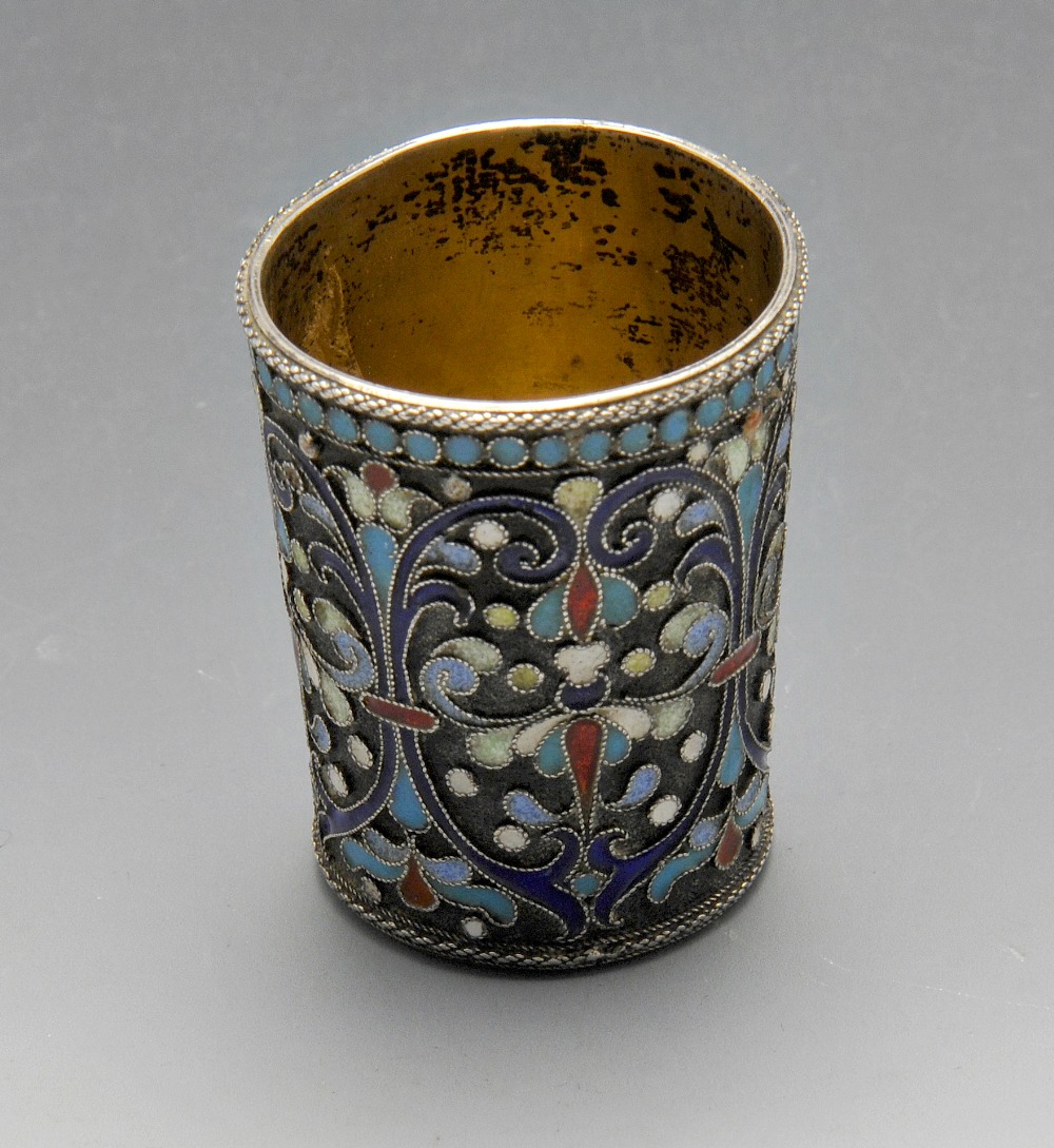 An early twentieth century Russian silver and cloisonnÚ enamel beaker or shot cup, the small,