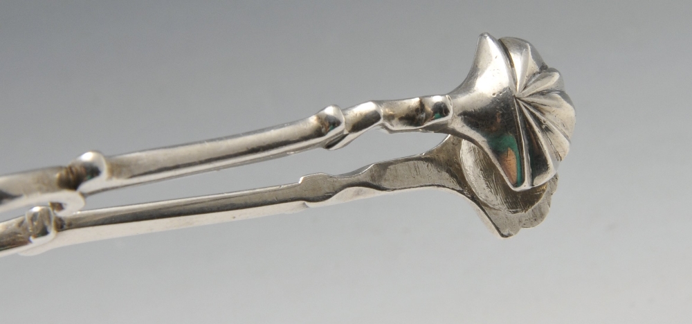 Two similar Georgian silver scissor action sugar tongs, with scroll arms and shell bowls. Part - Image 4 of 6