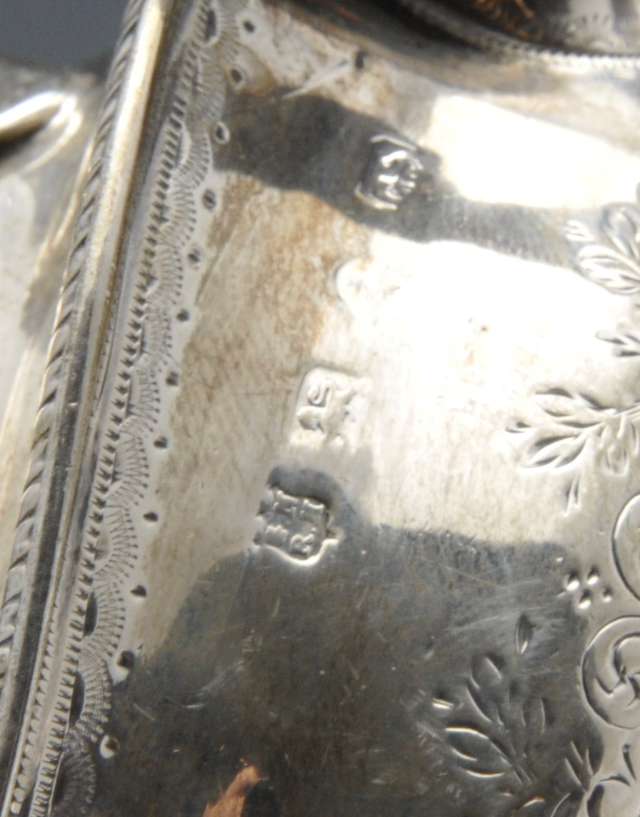 A Victorian silver teapot of oval form, the shaped body embellished with bright-cut floral scroll - Image 6 of 6