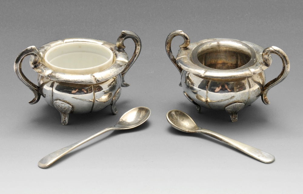 A matched pair of Chinese export silver salts of lobed form and scrolling handles. maker's mark HC