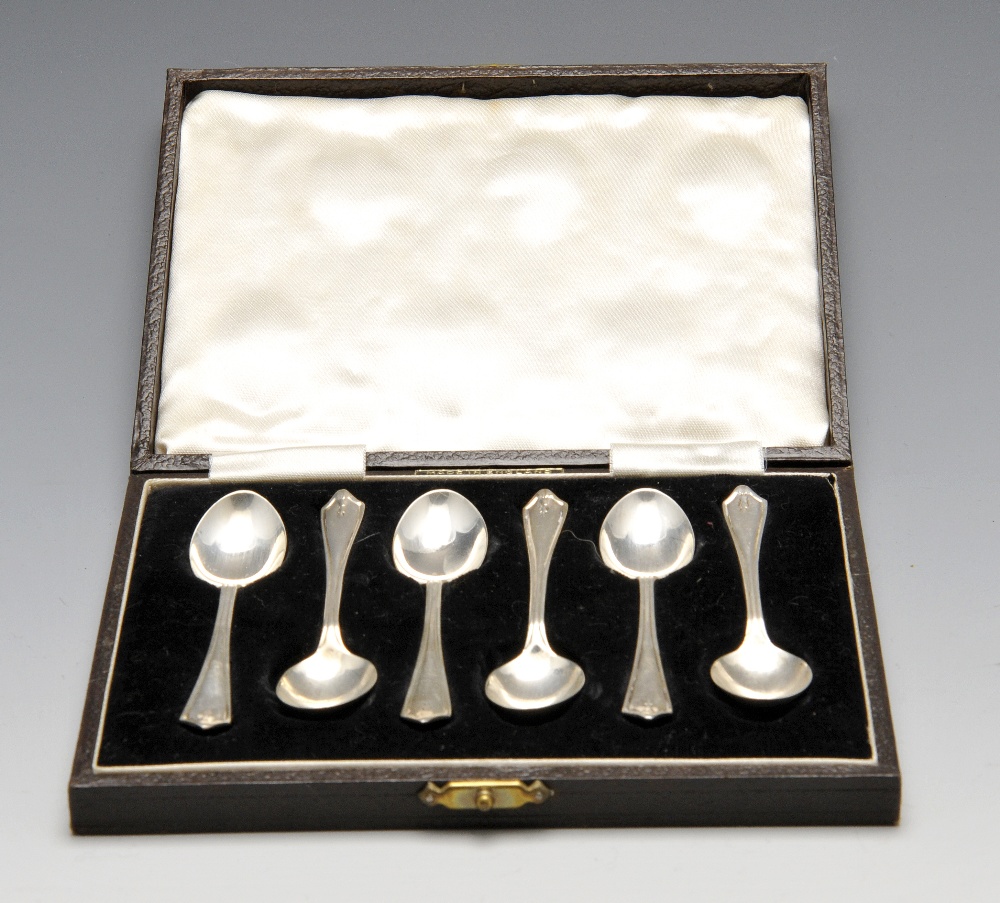 A cased set of six 1940's silver coffee spoons, each decorated with foliate pendant terminals.