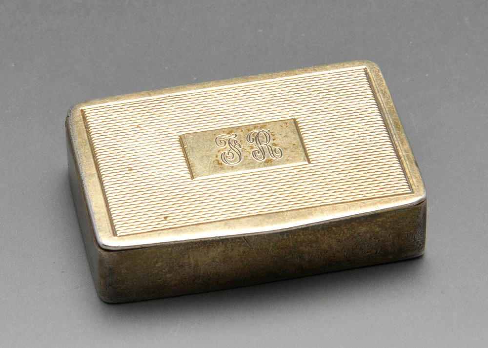 A 1960's silver-gilt small snuff or pill box, having engine-turned panel with central initialled