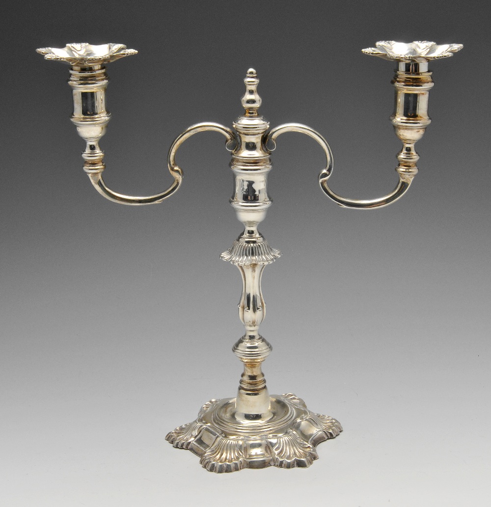 A 1970's silver twin-branch candelabrum, the shell cast sconces supported by twin scrolling branches