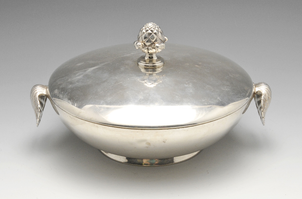 A Victorian silver serving dish and cover, the plain circular form with crest engraving, twin oyster