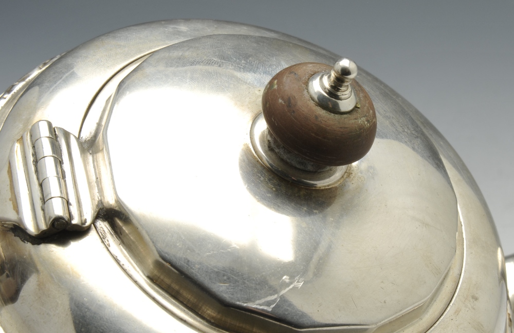 An early twentieth century silver three piece tea service, comprising teapot, milk jug and twin- - Image 3 of 11