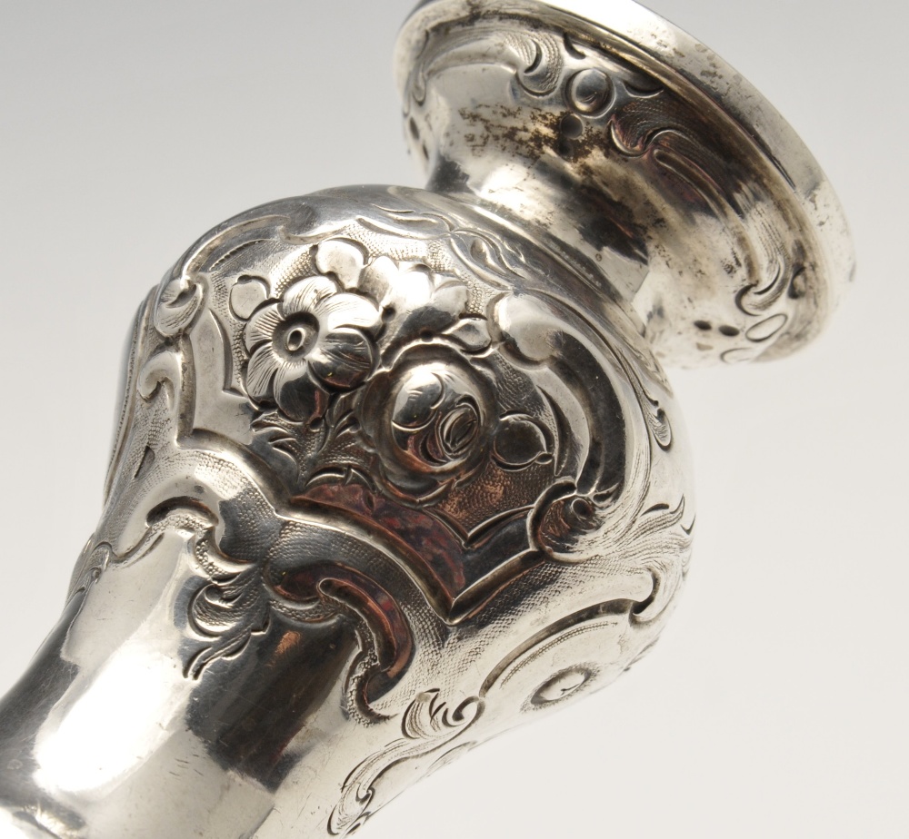 A mid-Victorian silver pepper pot with floral embossed decoration and engraved family crest, - Image 4 of 11