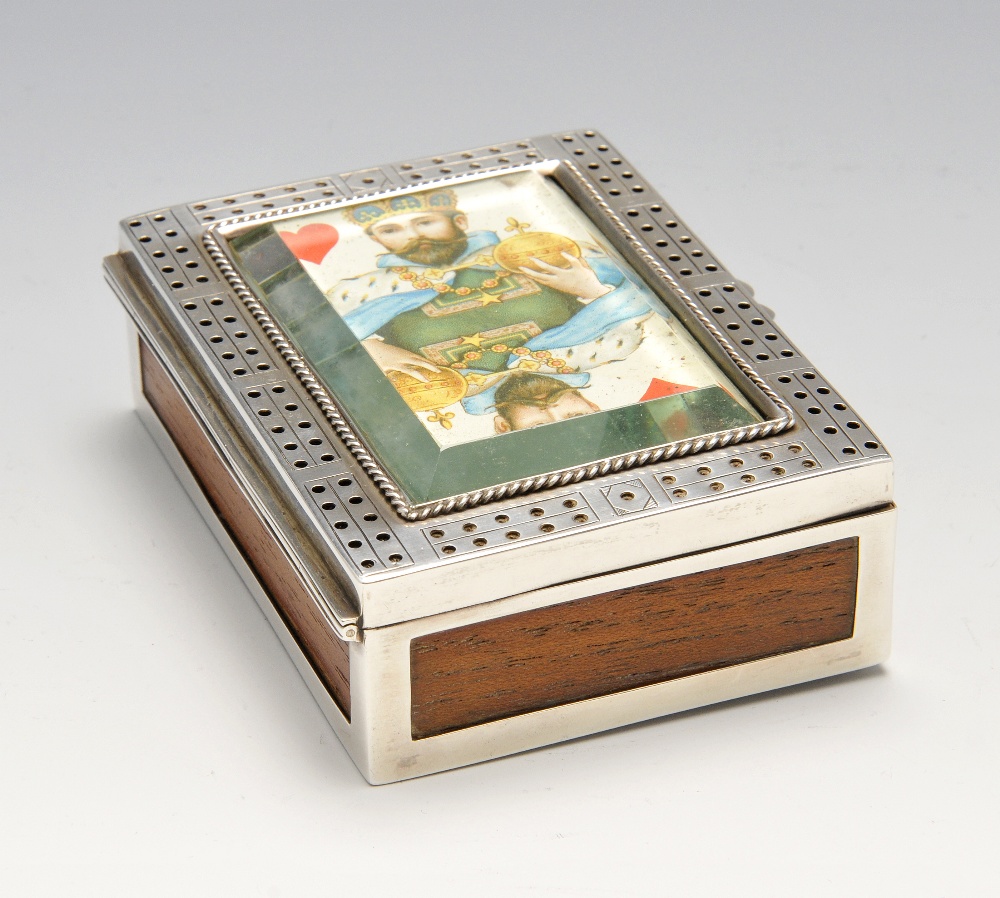 A late Victorian silver mounted playing card box, the wooden oblong body with cribbage board to