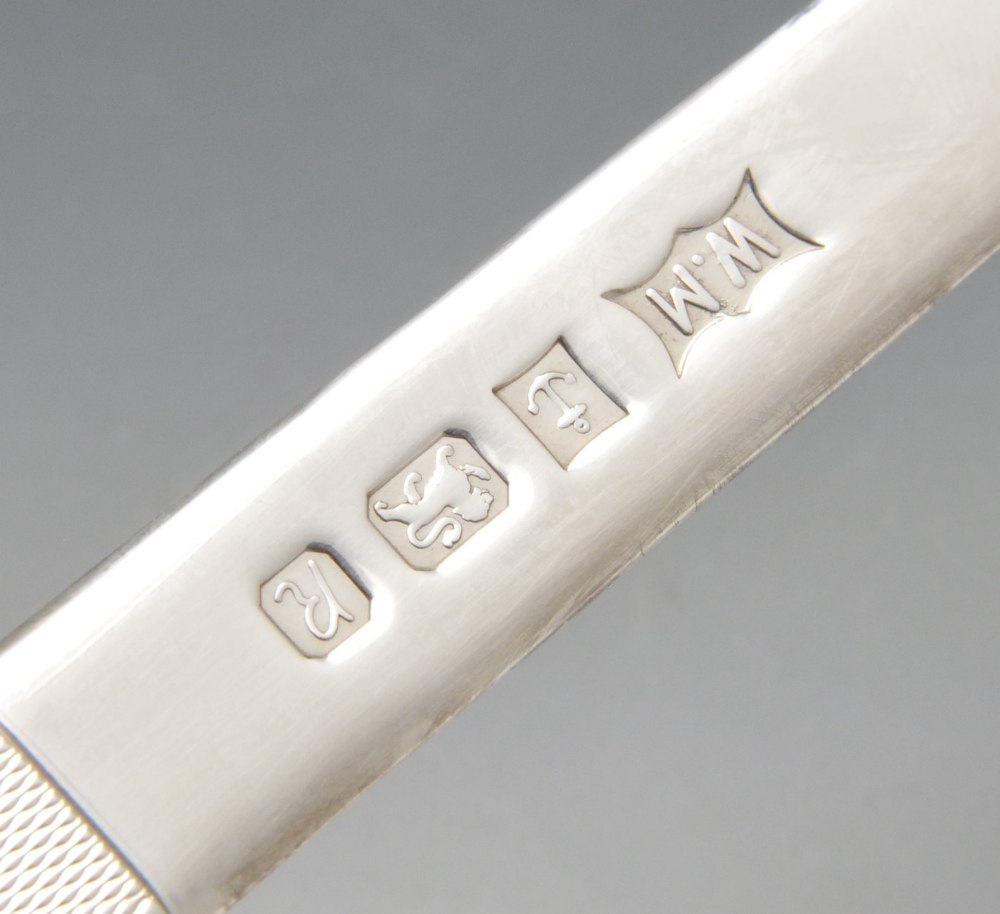 A modern silver letter opener, the plain tapering blade leading to the engine-turned handle. - Image 2 of 2