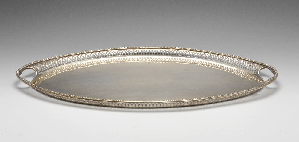 A large silver plated tray of navette form, the raised pierced gallery with beaded rim, maximum