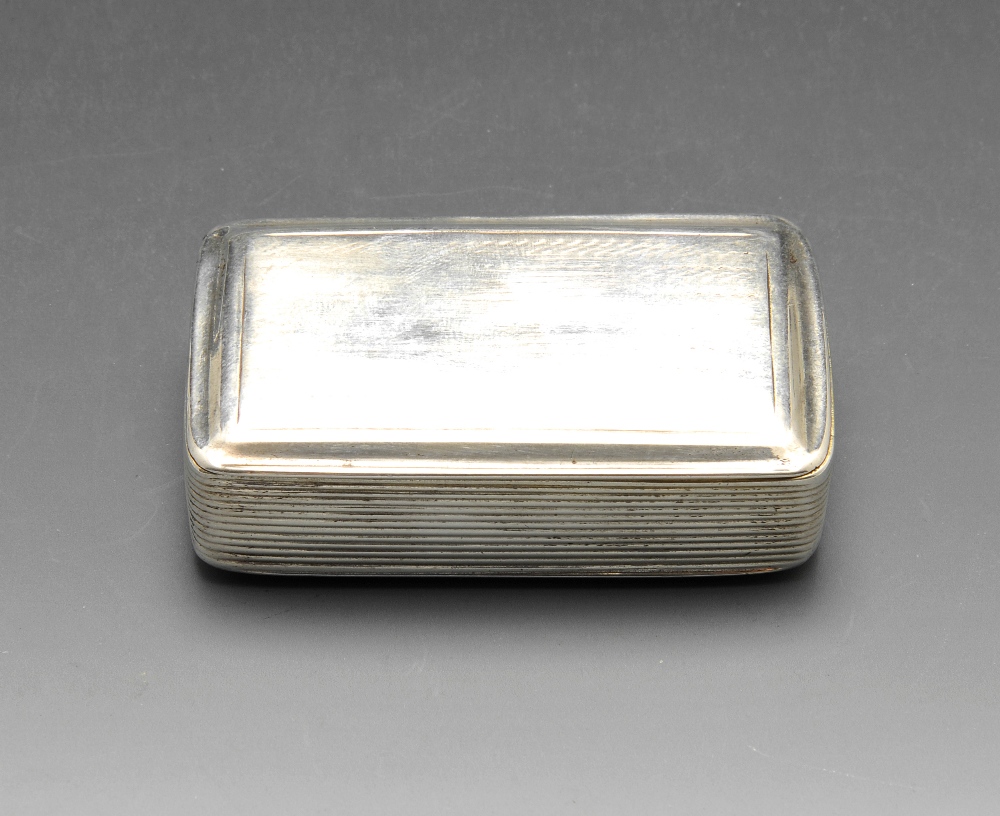 A William IV silver snuff box of rounded rectangular form with reeded sides, the hinged lid