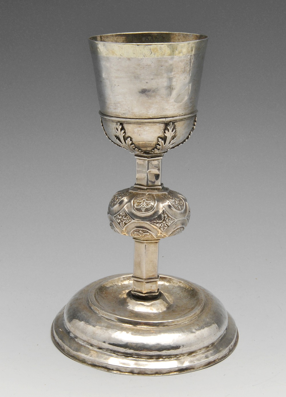 A continental Chalice, the wide stepped and domed base rising to the hexagonal stem with bulbous