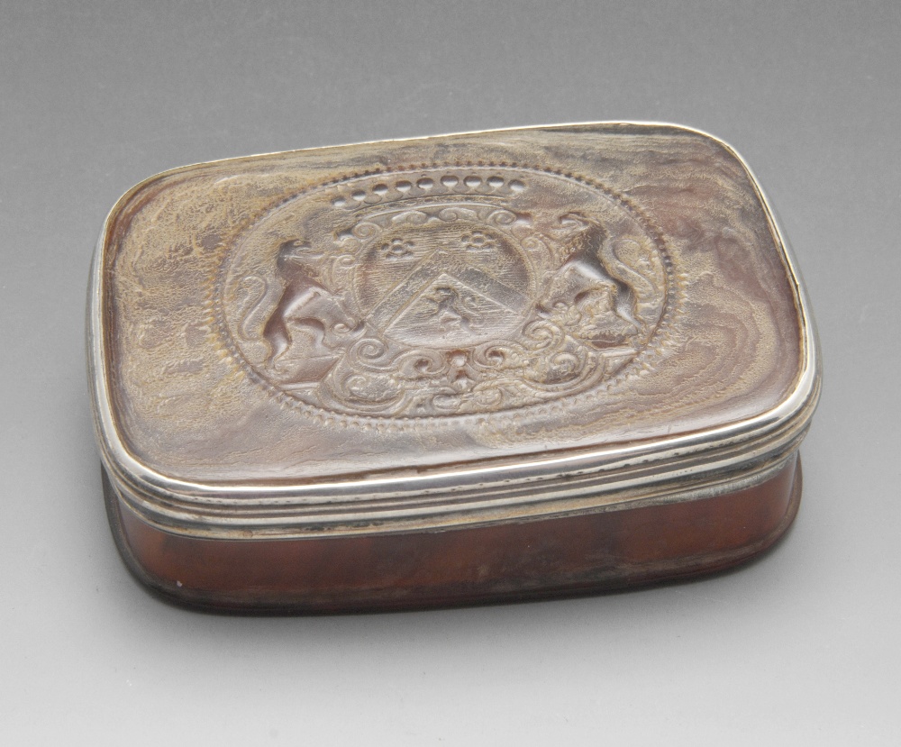 A tortoiseshell box of oblong form with armorial to the detachable cover within white metal reeded