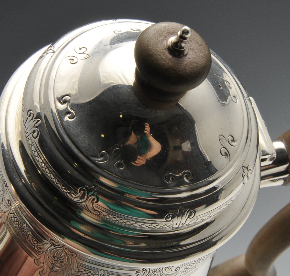 A 1920's silver coffee pot of plain tapered form, the rim and hinged cover embellished with a floral - Image 5 of 5