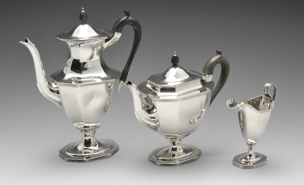 An early twentieth century silver three piece tea service, comprising teapot, coffee or hot water