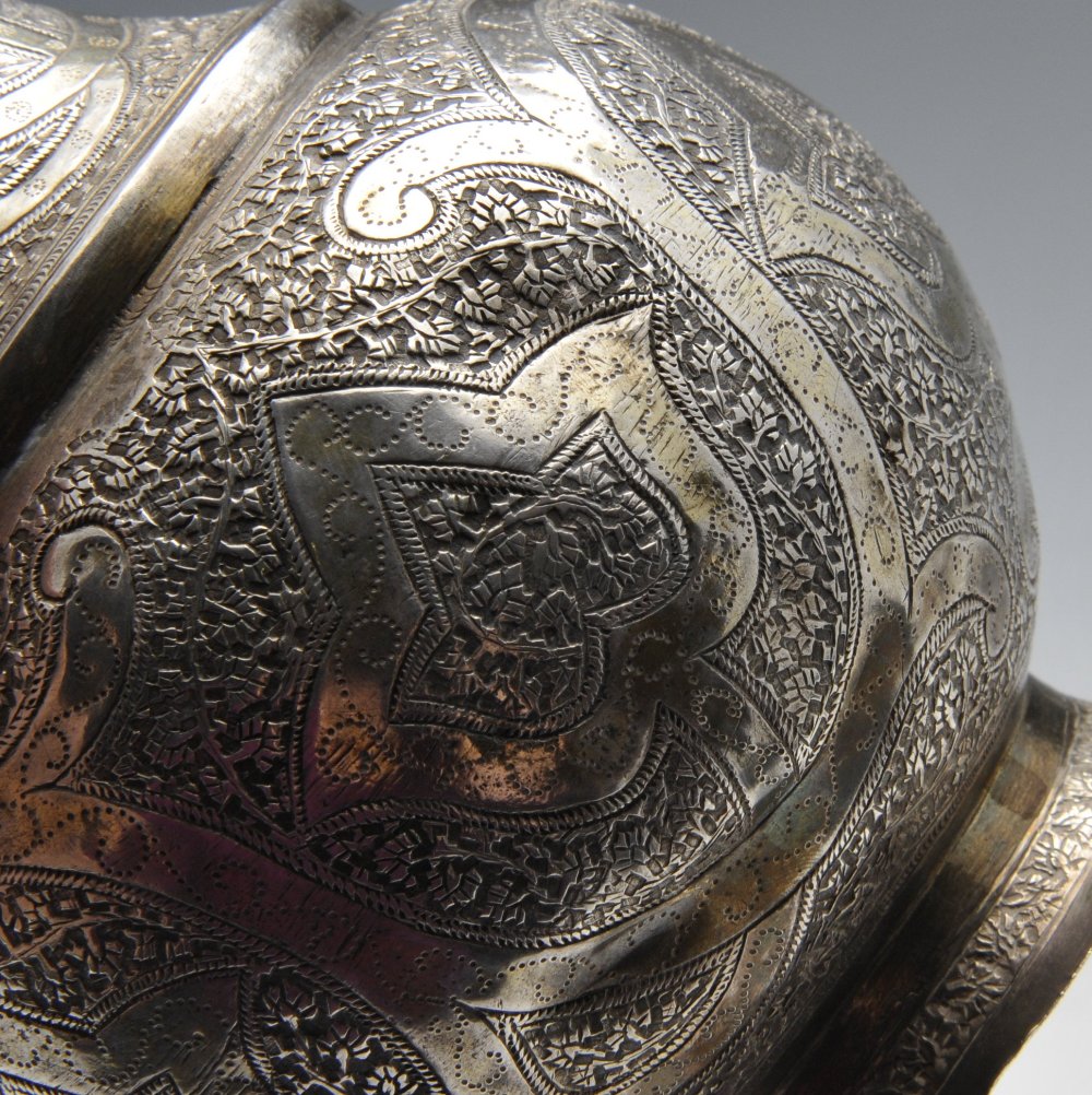 A Persian jug of vase form and ornately close chased with foliate decoration and matching tapered - Image 3 of 4