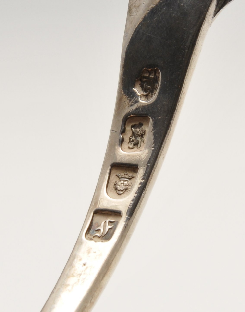 An early George III silver soup ladle with shell and scroll terminal and crest engraving to the - Image 2 of 6
