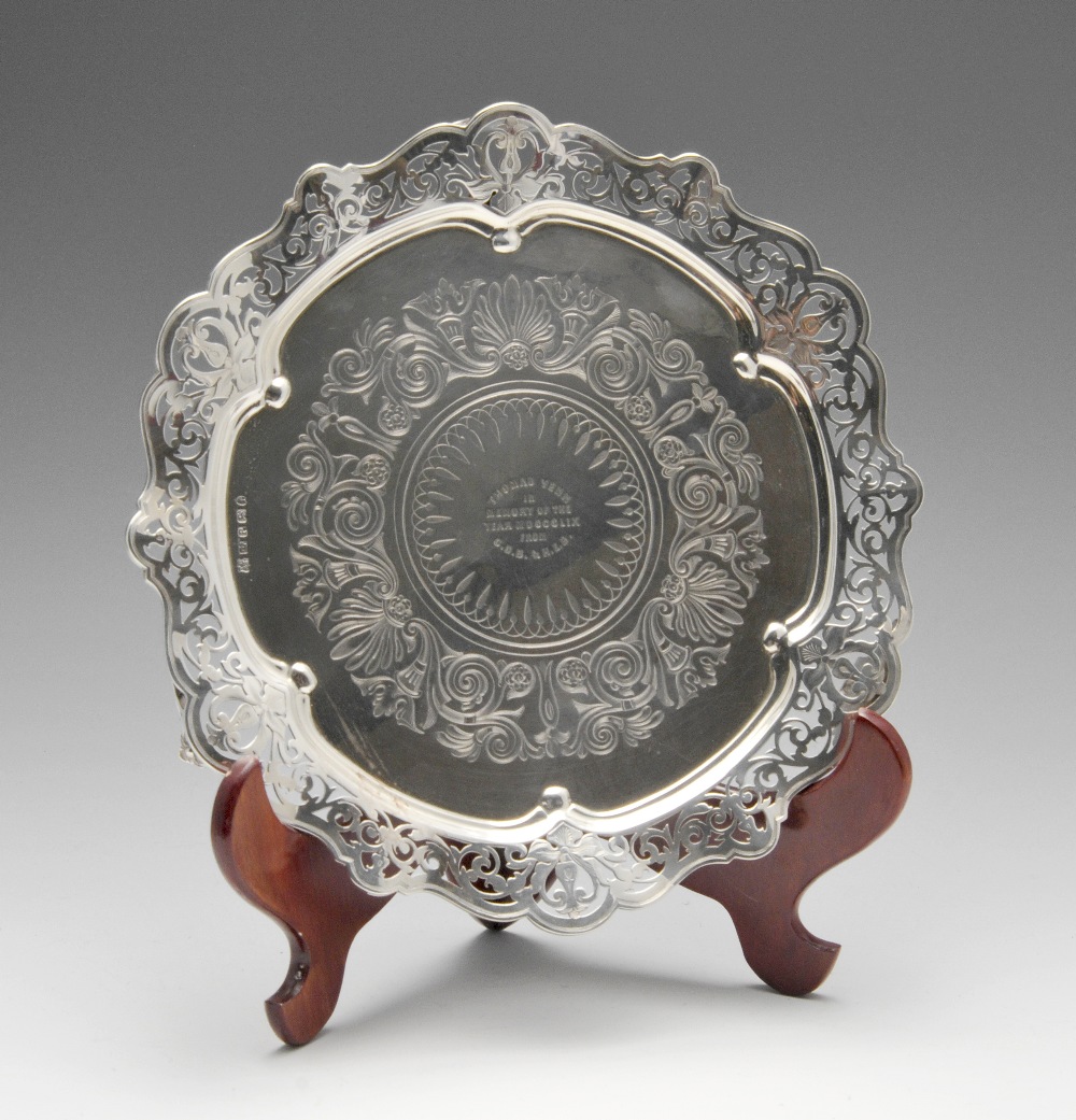 A mid-Victorian silver salver of shaped circular form with foliate scroll pierced rim enclosing a