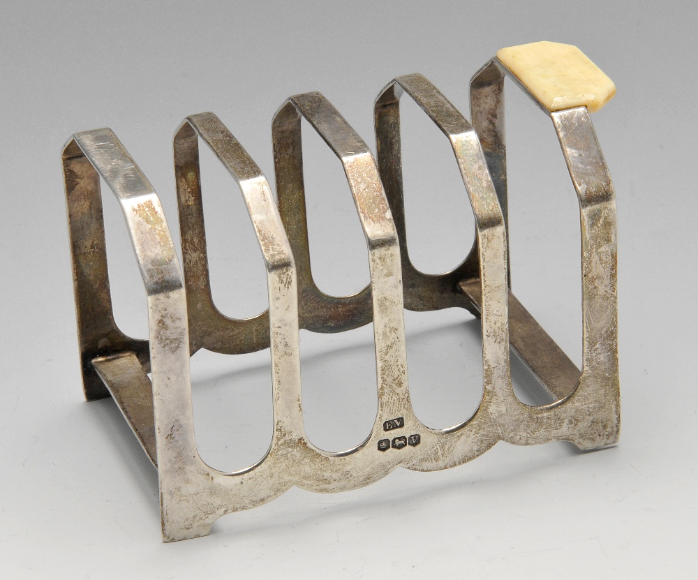 A 1930's silver four-divide toast rack with ivory handle. Hallmarked Viner's Ltd (Emile Viner),