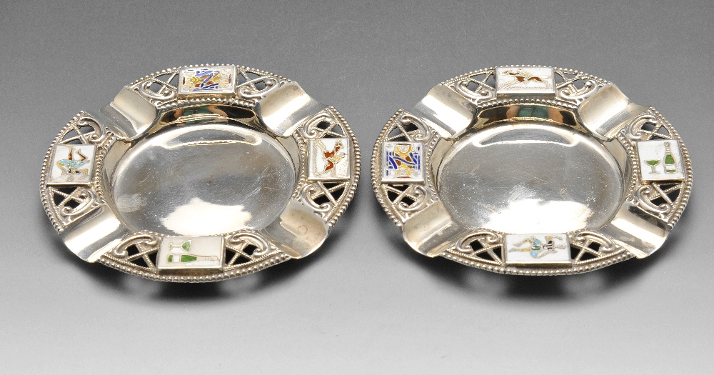 A pair of late Victorian silver ashtrays, each of circular form with beaded pierced border decorated