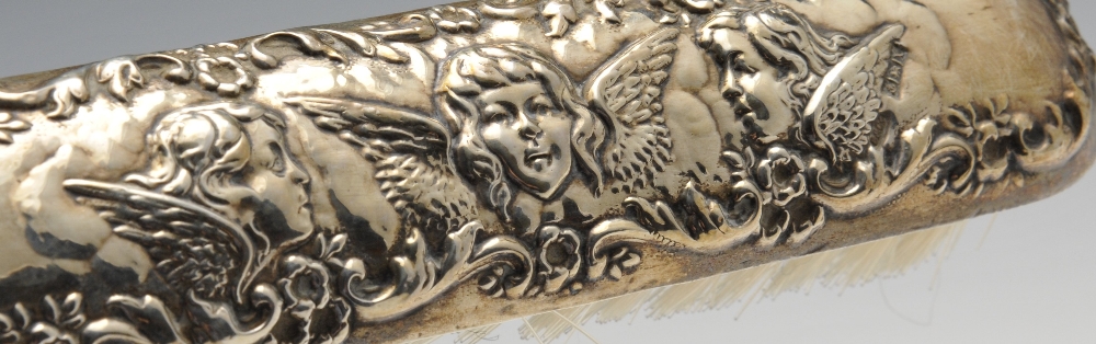 A 1970's silver mounted part dressing set having embossed cherub decoration within floral scrolls, - Image 5 of 8