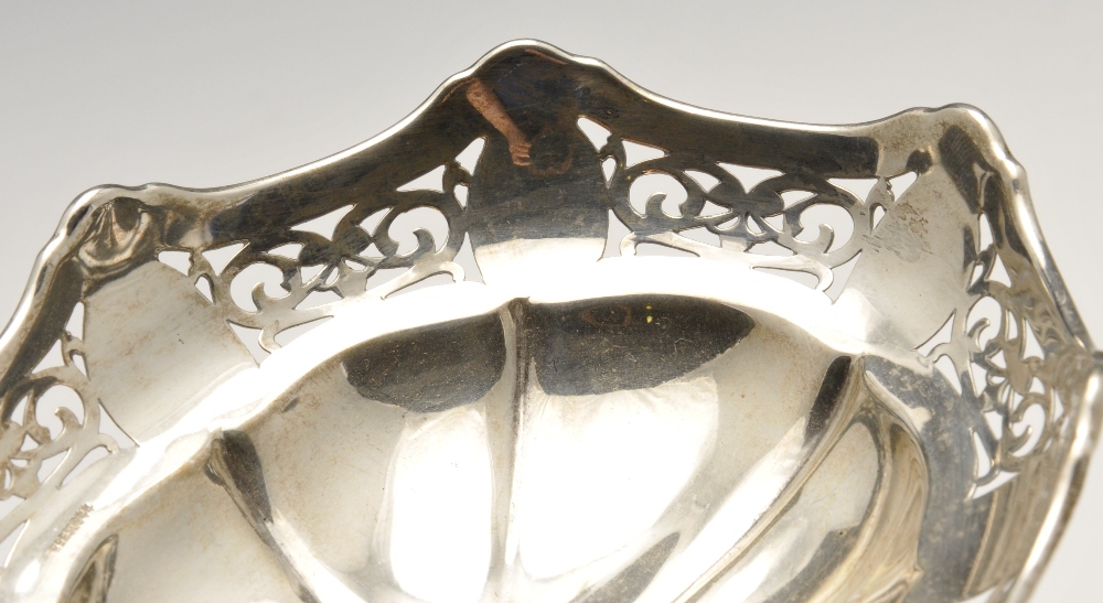 A 1920's silver pierced bonbon dish, of oval outline having scalloped rim and pierced border leading - Image 6 of 7