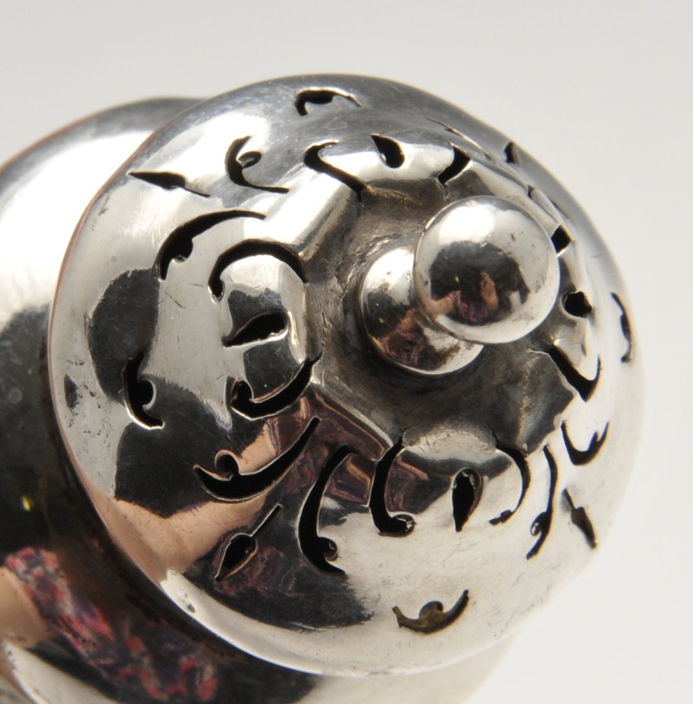 A mid-Victorian silver pepper pot with floral embossed decoration and engraved family crest, - Image 6 of 11