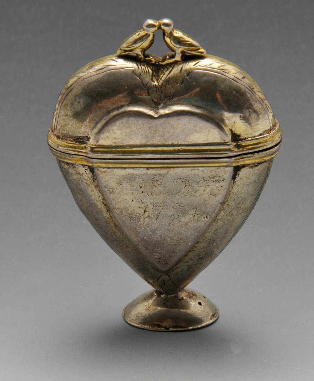 A late eighteenth century Scandinavian Hovedvansaeg, the heart shaped box standing on a flared foot,