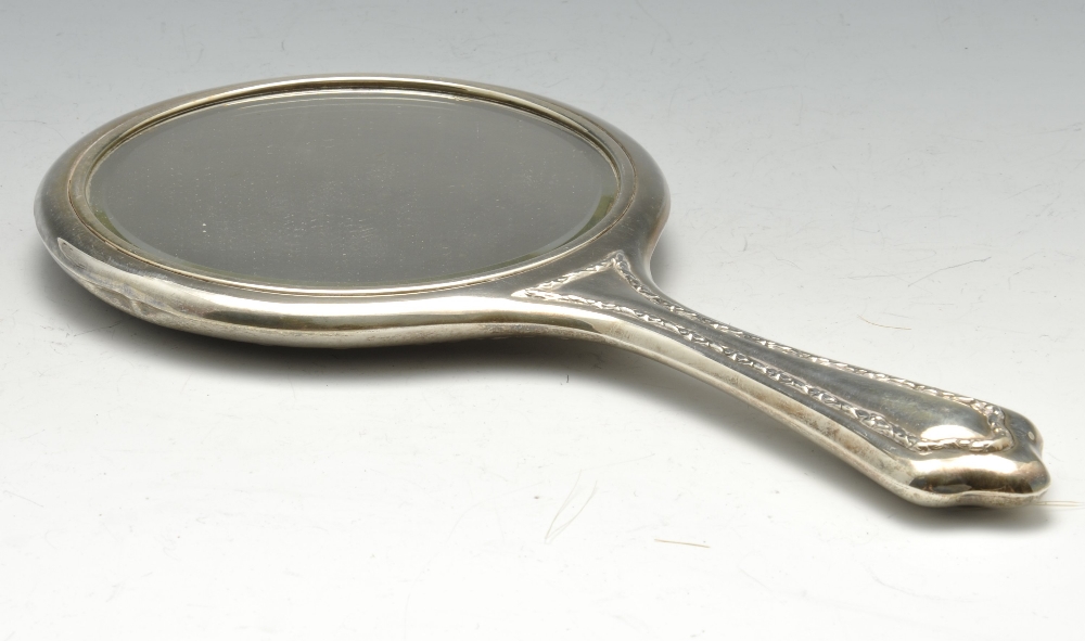 A 1920's silver mounted dressing table set comprising a hand mirror, a pair of hairbrushes and a - Image 2 of 6