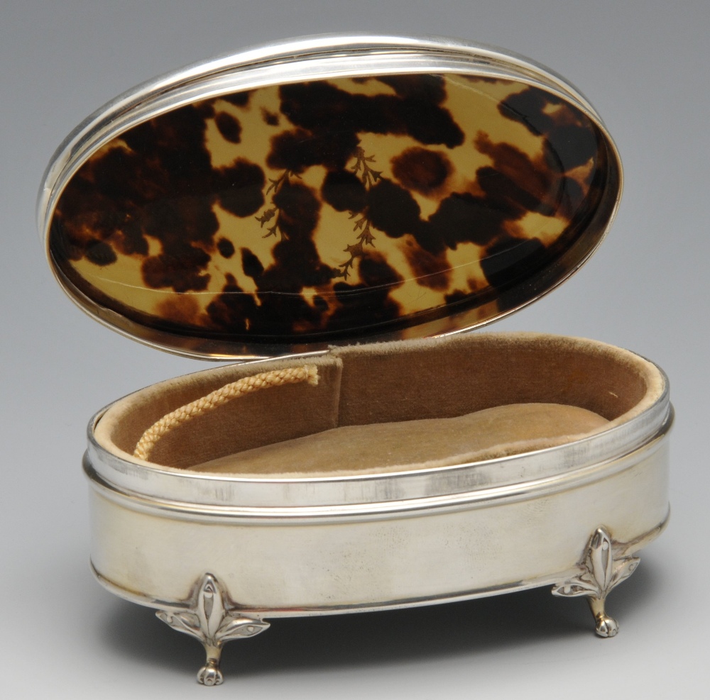 An early twentieth century silver and tortoiseshell trinket box, the oval form inlaid with a - Image 2 of 4