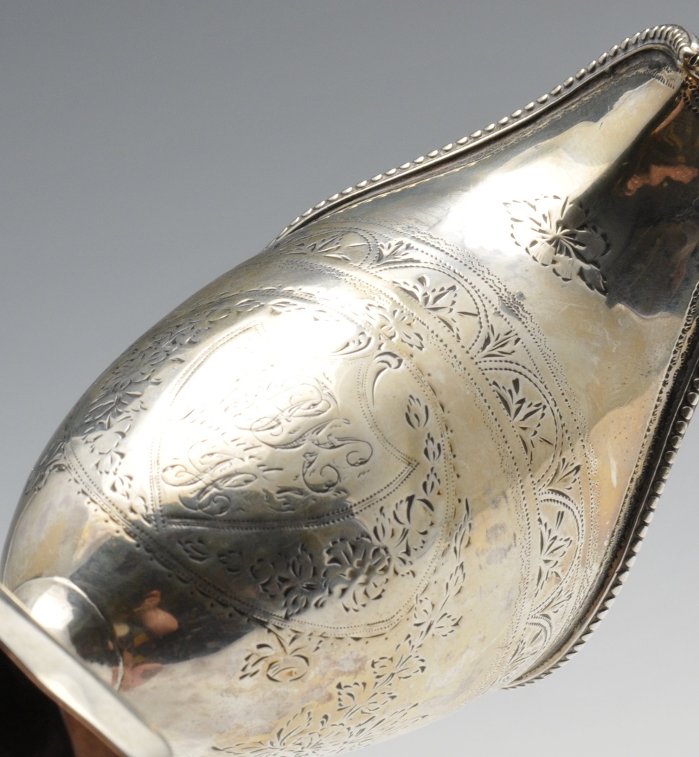 A George III silver helmet jug, the classic form with engraved floral and foliate borders, - Image 3 of 5