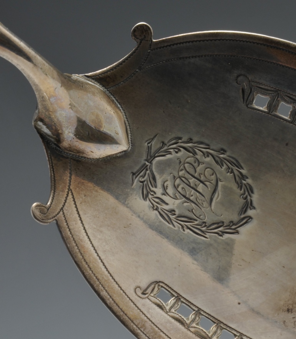 A George III silver fish slice, the oval blade with engraved and pierced border, monogram with - Image 3 of 4