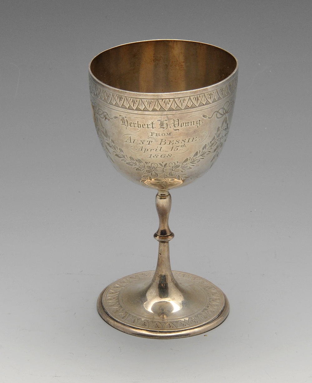 A Victorian silver goblet engraved with floral swags and presentation inscription. Hallmarked H J