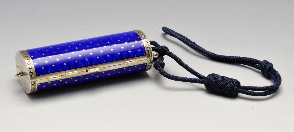 A 1920's Scottish import silver-gilt and enamel minaudiere, the hinged cylindrical body with blue