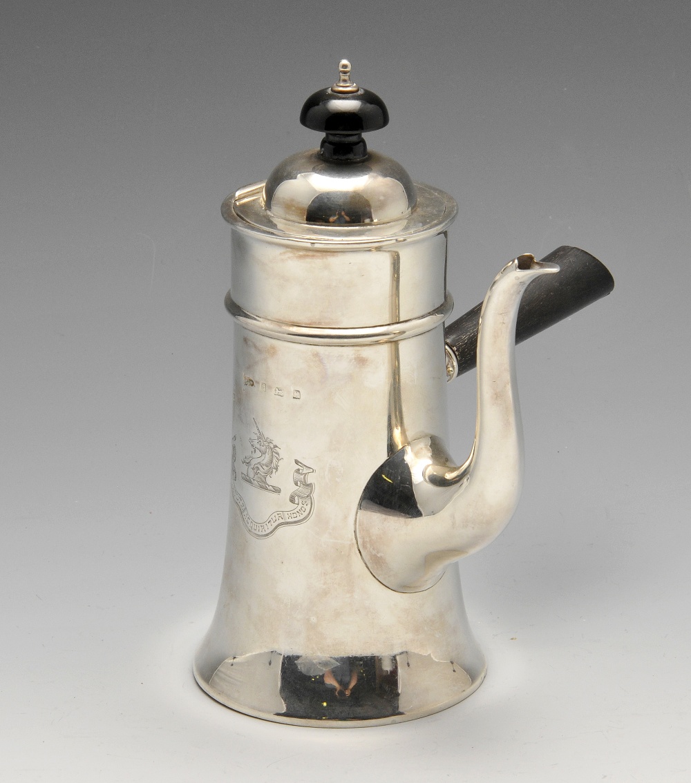 An Edwardian silver cafe-au-lait pot, the tapered body, crested and flared at the base rising to the