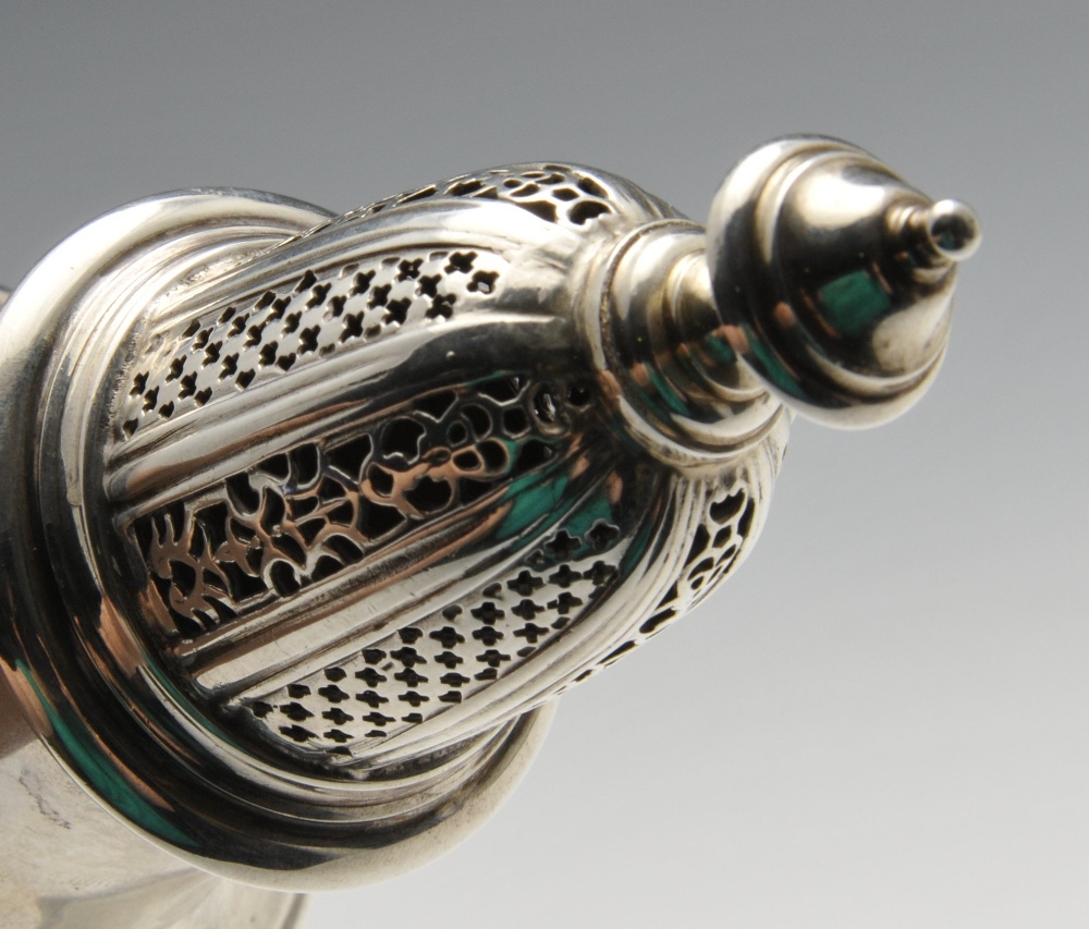 A modern silver caster in Georgian style, the vase shaped body with embossed girdle, raised on a - Image 3 of 3