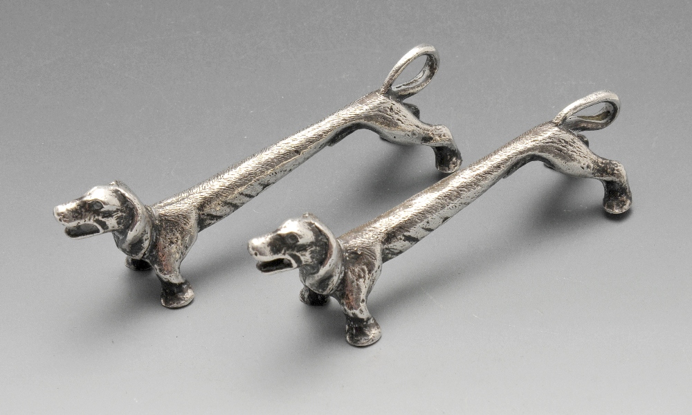 A pair of modern novelty silver knife rests modelled as Dachshunds. Hallmarked Roberts & Dore Ltd,