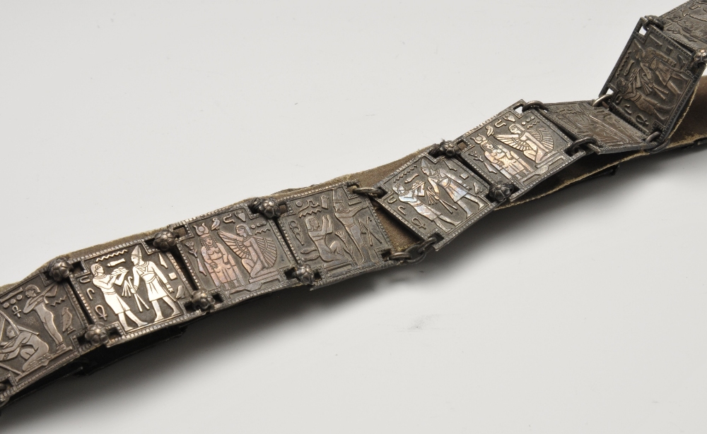 A white metal Egyptianesque belt, formed as twenty-two square links with stylised figural scenes. - Image 3 of 3