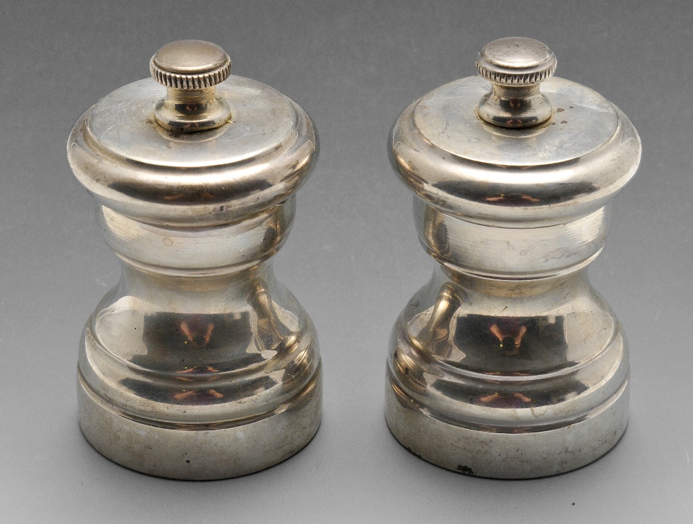 A pair of modern continental small pepper grinders of classic baluster form. Marked Sterling. Height