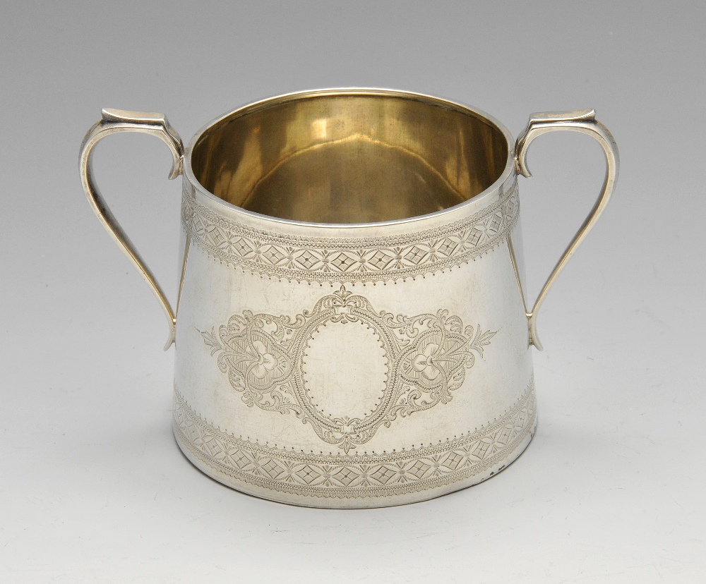 A Victorian silver twin-handled sugar bowl, the tapered form with engraved floral motif border and