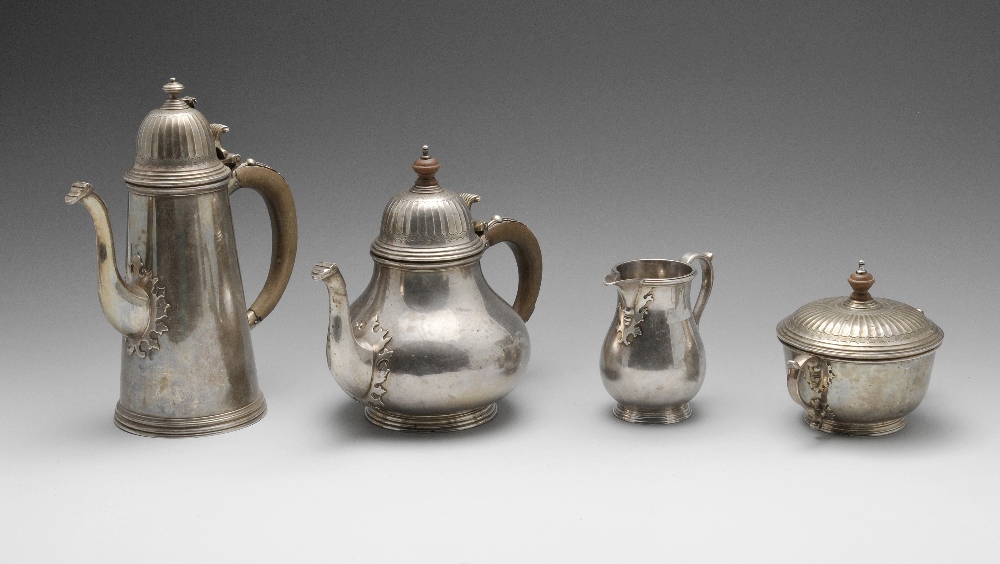 A 1960's silver four piece tea service, comprising teapot, coffee pot, milk jug and twin-handled