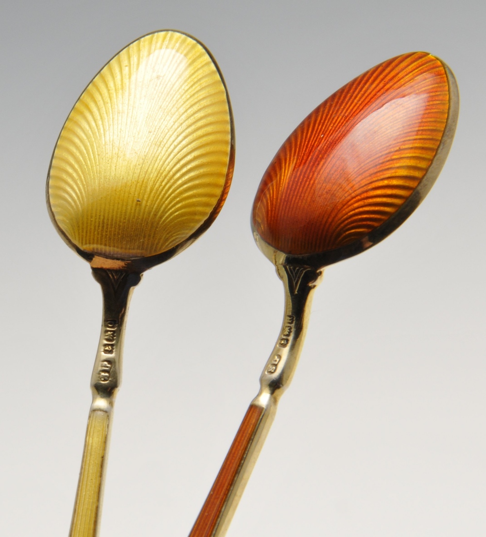 A cased set of six 1940's silver-gilt coffee spoons each having enamelled stems and bowls of varying - Image 2 of 4