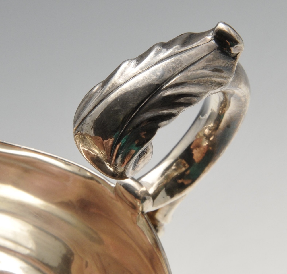 A late Victorian silver sauce boat, of typical bellied form with shaped rim, foliate capped flying - Image 3 of 4