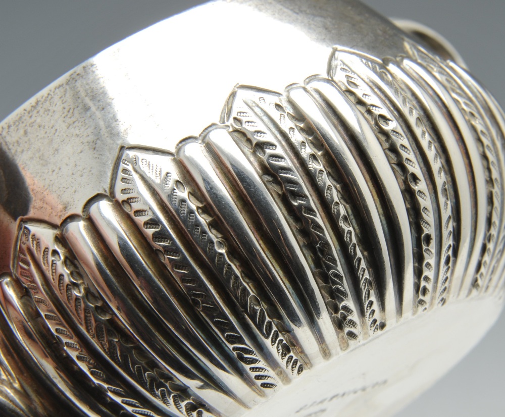 A late Victorian silver sugar bowl, the circular body part fluted with foliate accents and twin - Image 5 of 6