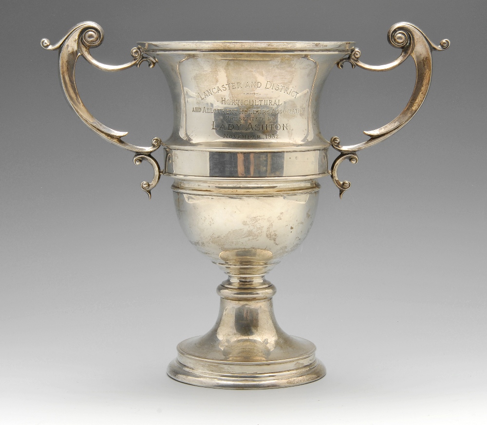 A 1930's silver twin-handled trophy cup of campana form with presentation engraving to one side,