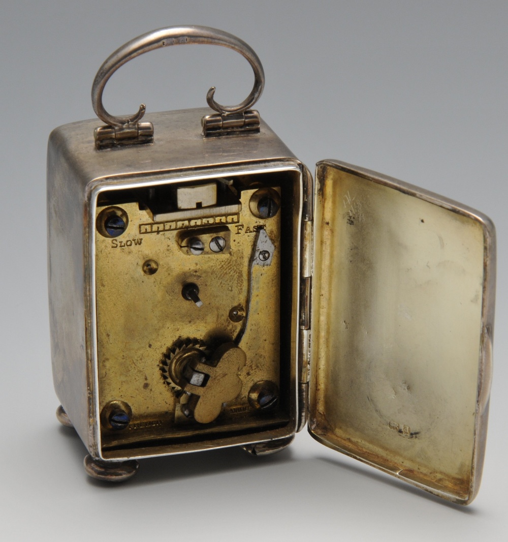 An Edwardian silver carriage clock, the plain oblong form standing on bun feet, circular aperture - Image 4 of 4