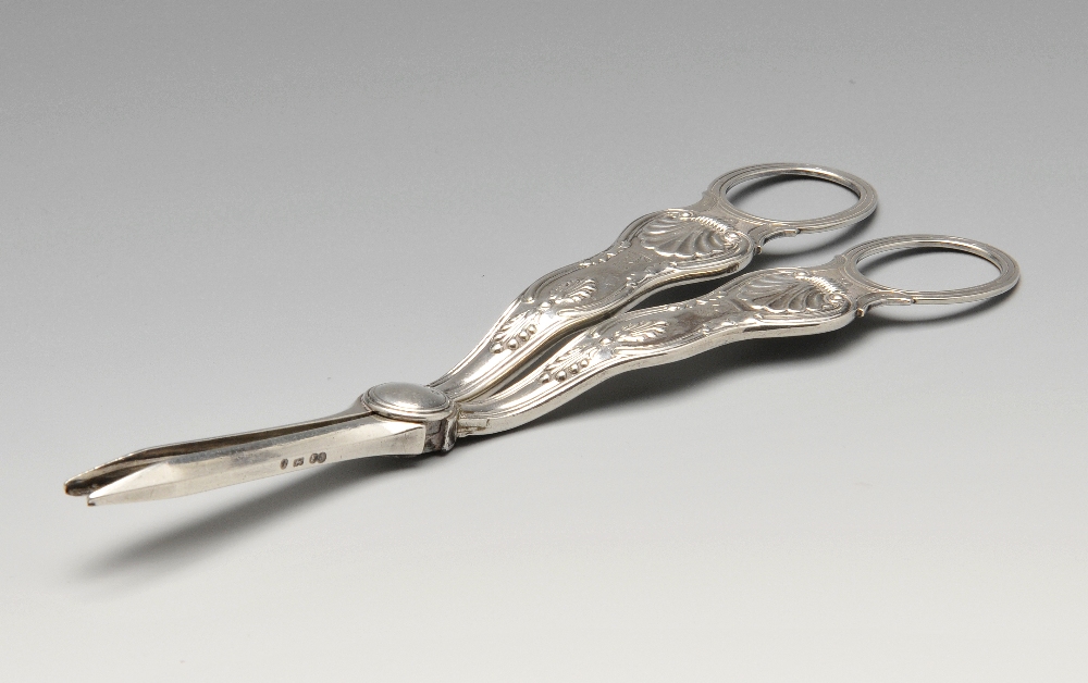 A pair of Victorian grape scissors in King's pattern with engraved crest and reeded, oval form