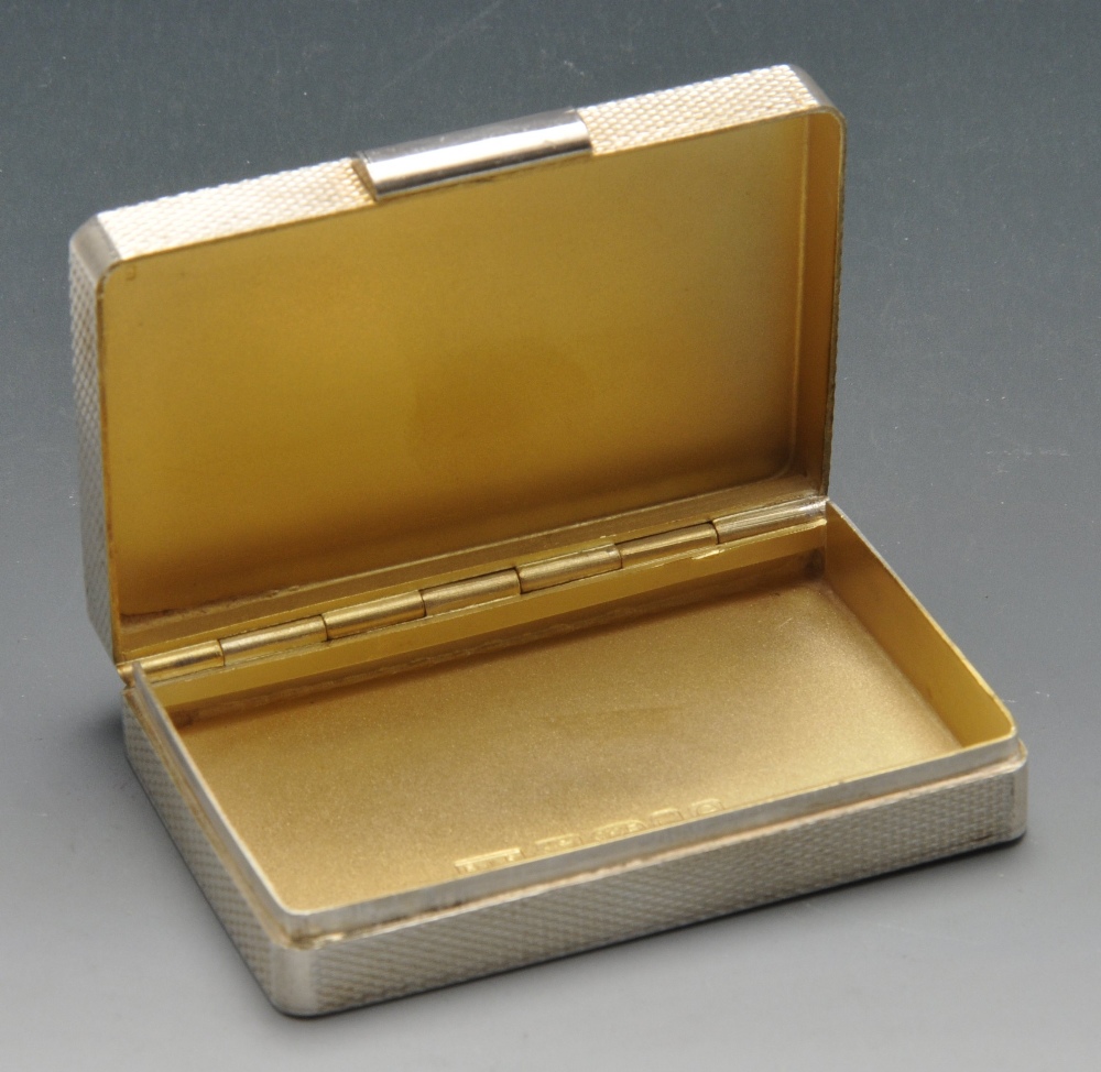 A modern silver pill box of rectangular form having engine turned exterior to the whole and with - Image 2 of 7