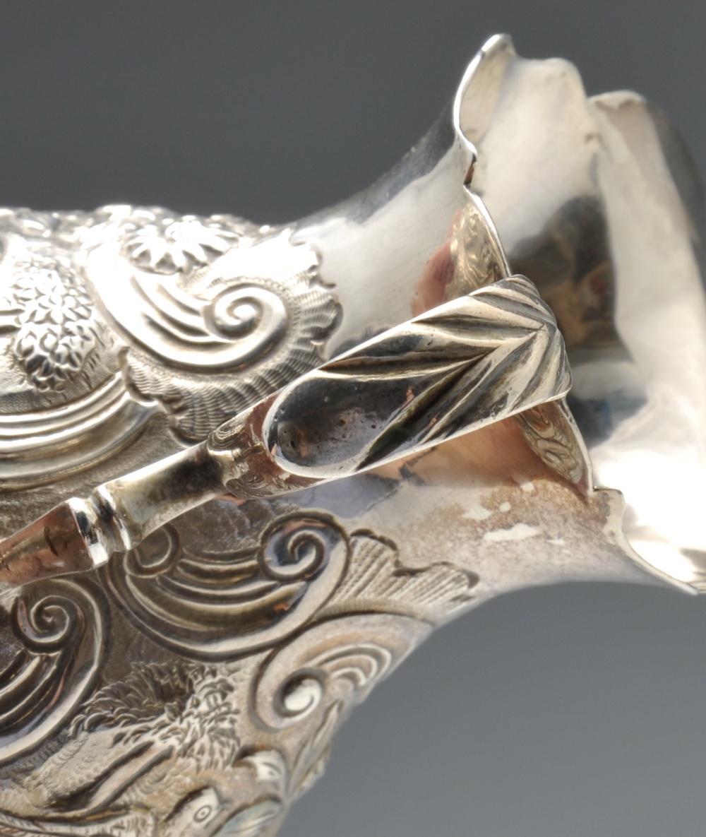 A George II silver cream jug, of globular form having waisted neck and shaped rim, decorated with - Image 6 of 9