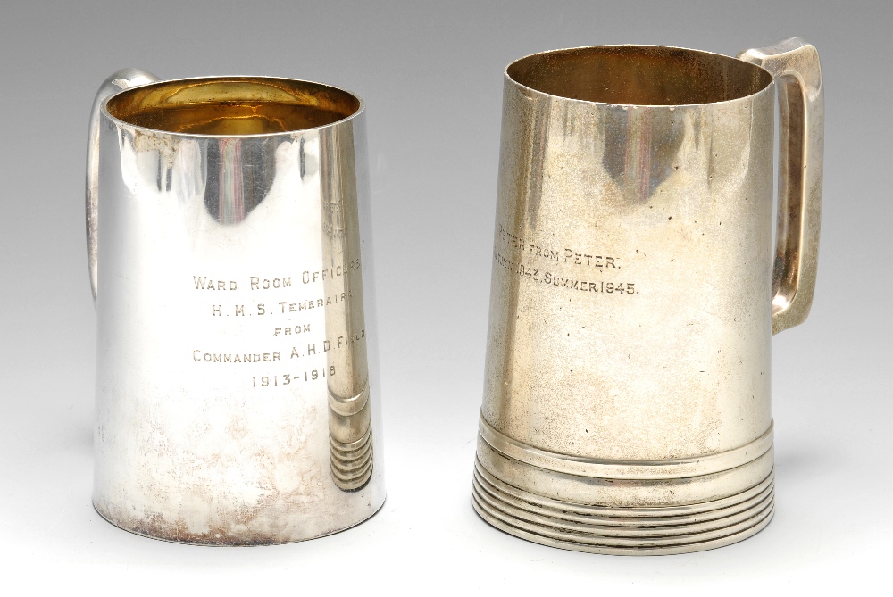 An early twentieth century silver mug of slightly tapering form to a glass base, presentation