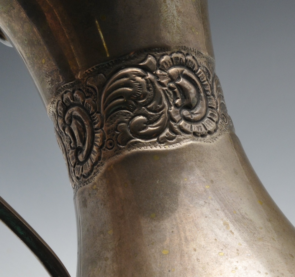 A Continental silver jug, of part fluted baluster form embossed with floral bands. Marked beneath - Image 5 of 5